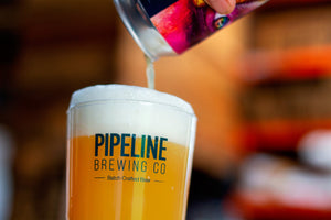 pouring a glass of pipeline brewing co all eyes on you IPA